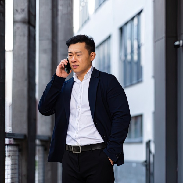 Man on phone with insurance after a car accident