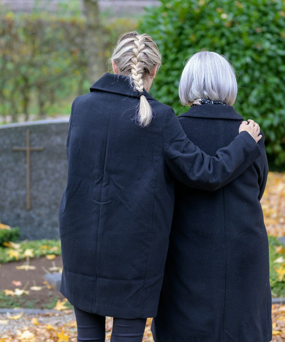 Grieving women at a gravesite