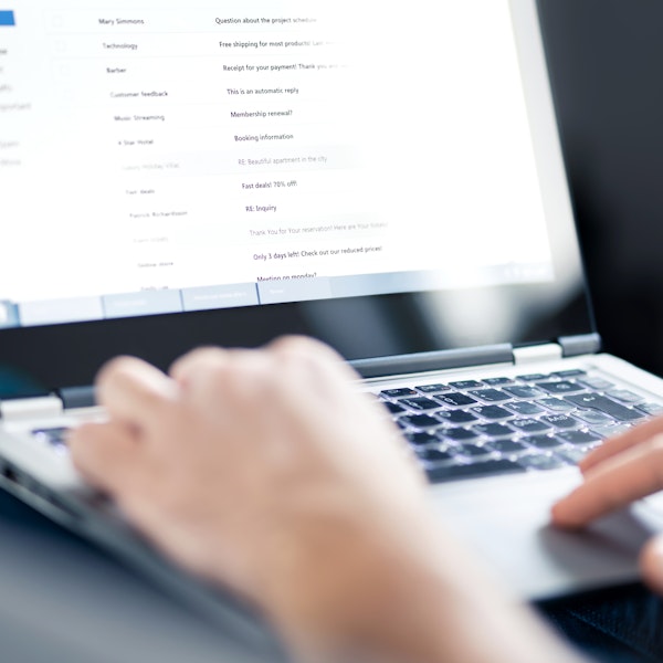 Person typing on keyboard