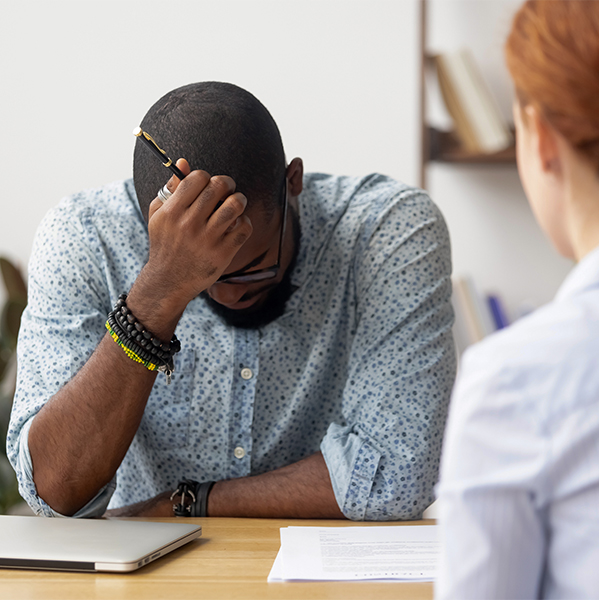 man being scolded at work