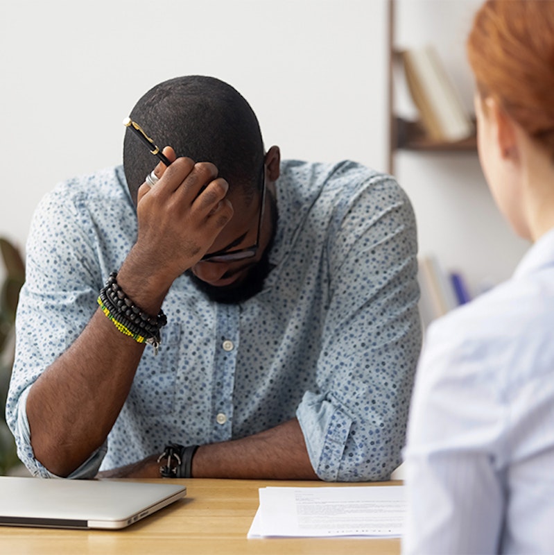 man being scolded at work