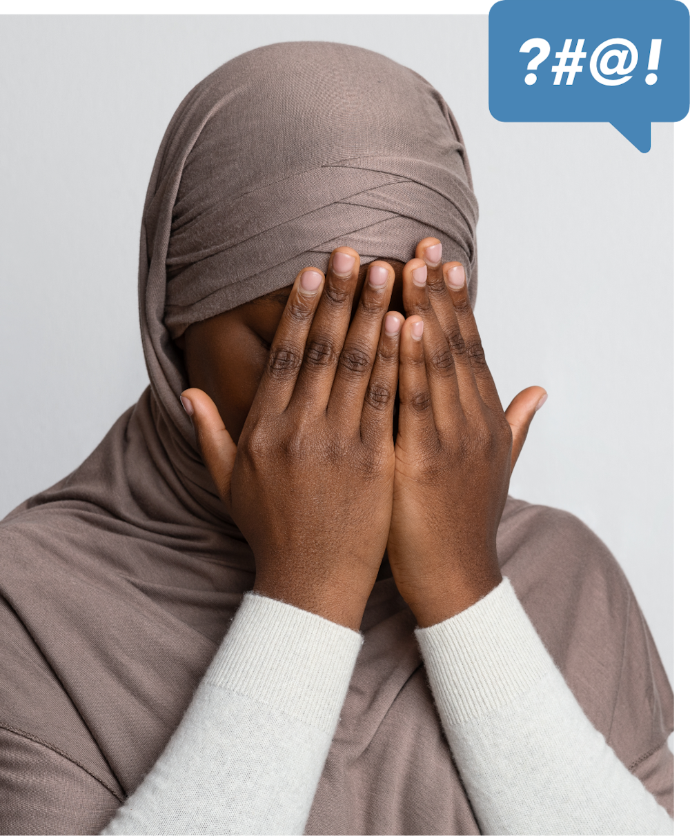 Muslim woman covering face in shame after suffering harassment