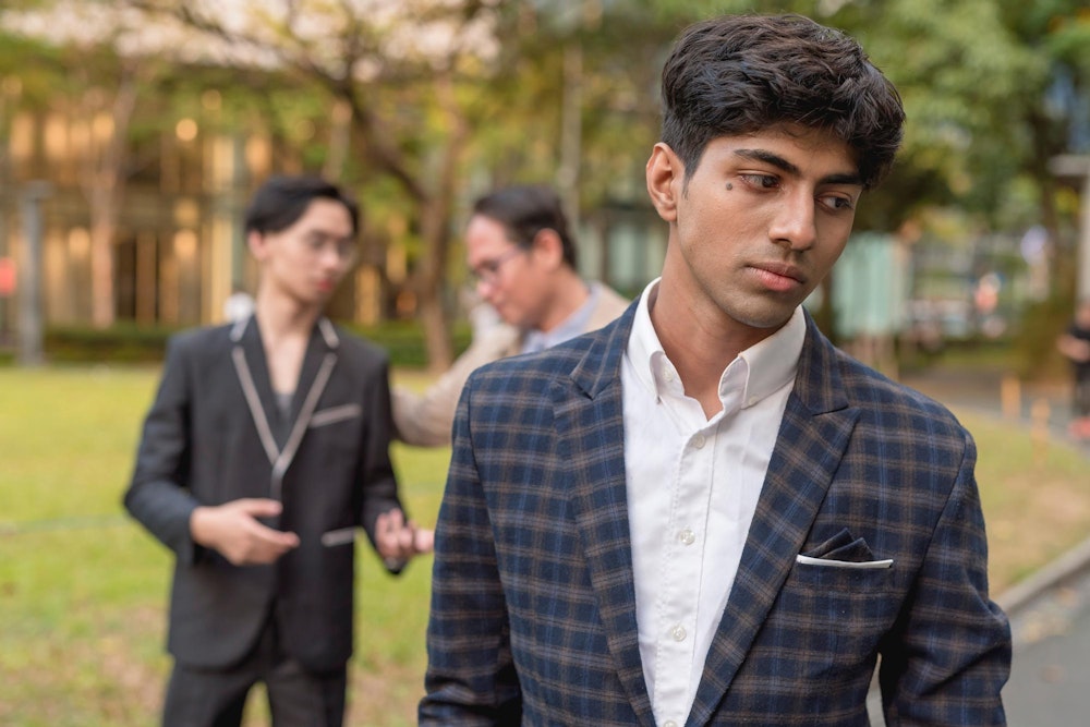 Upset worker experiencing racial discrimination