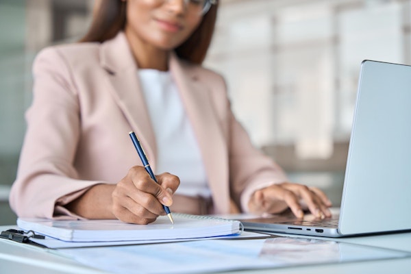 Woman writing in journal