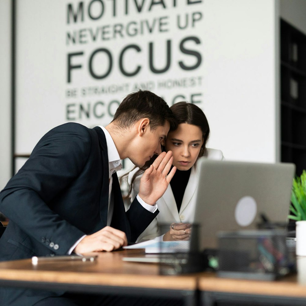 Coworkers whispering