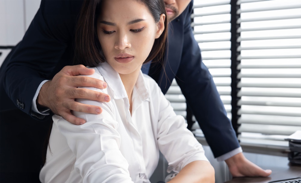 woman being sexually harassed at work