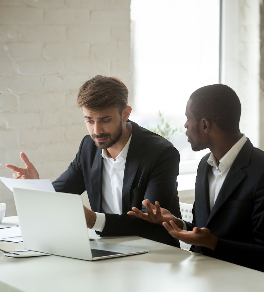 two business men having a heated discussion at work