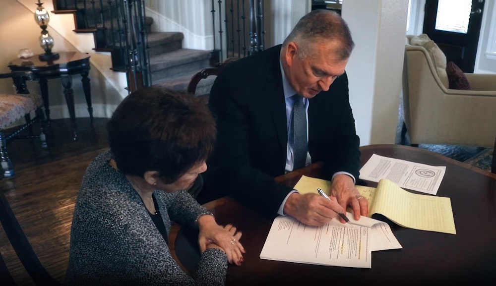 Dan Atkerson reviewing documents with a client