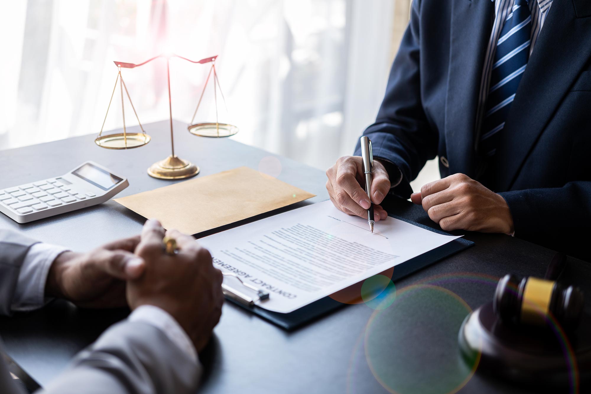 lawyer signing paperwork