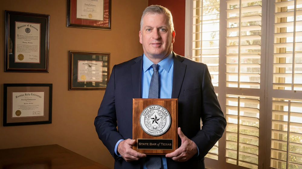 Dan A. Atkerson with a plaque