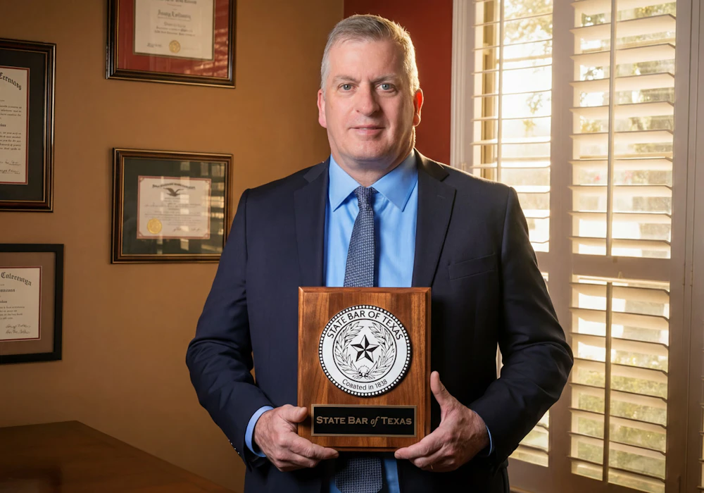 Dan A. Atkerson with a plaque