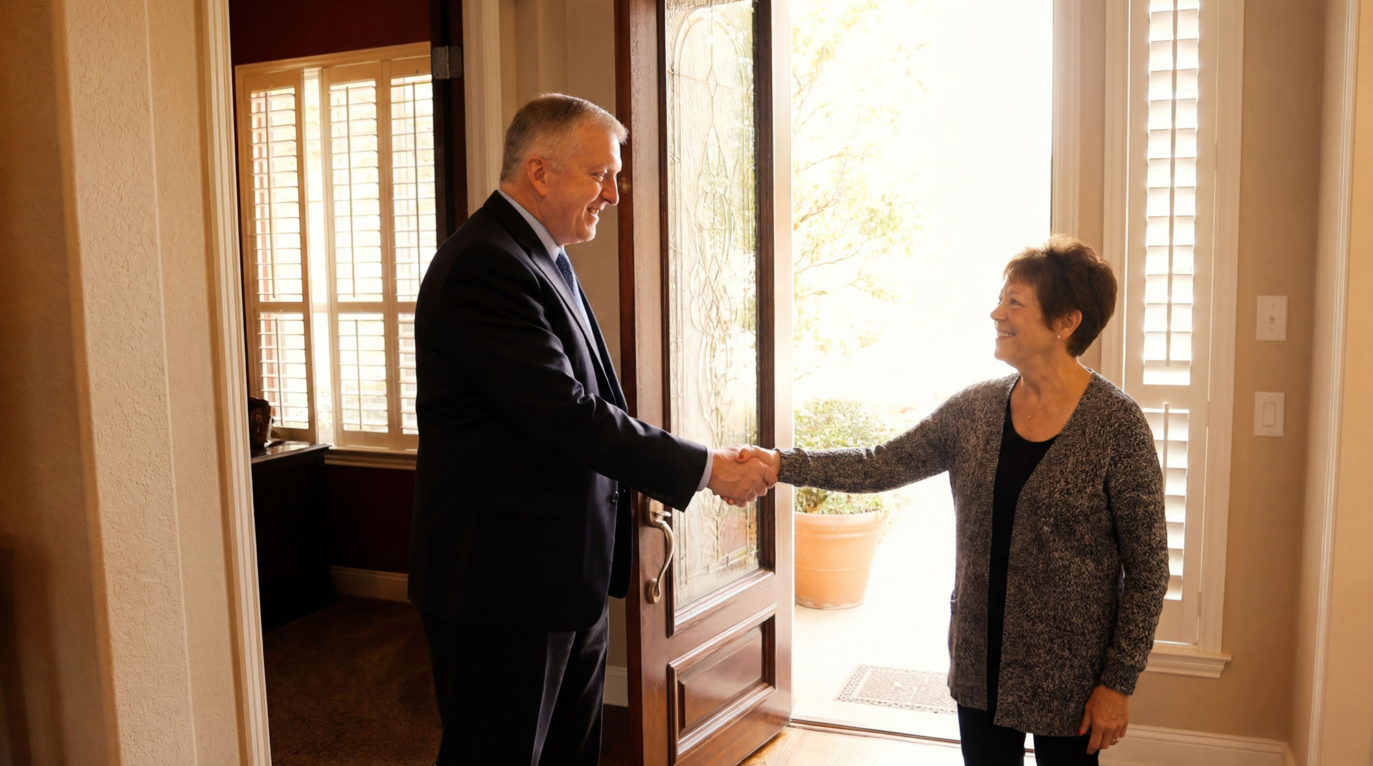 Dan Atkerson shaking hands with client