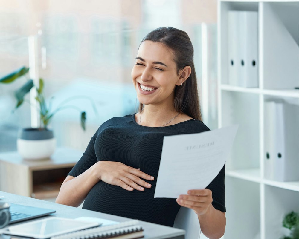 Pregnant working woman sitting down