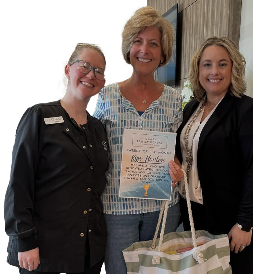 Smiling patient of the month with our staff