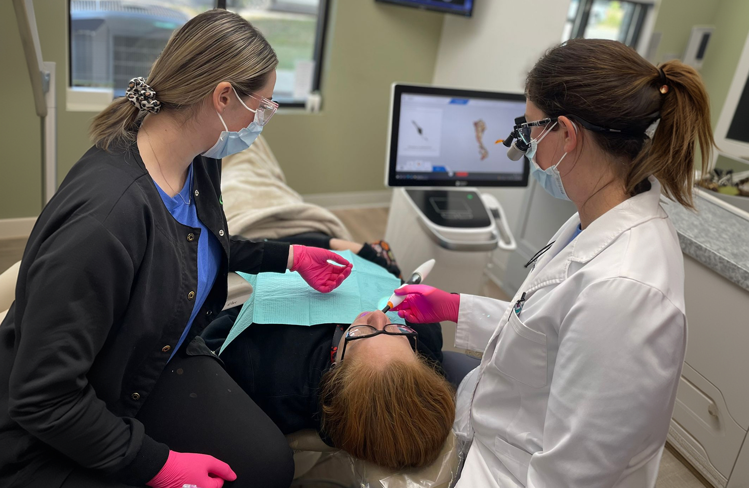 Dentist w/ patient at Gooch Dental