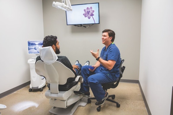 Dr. Ip with a patient