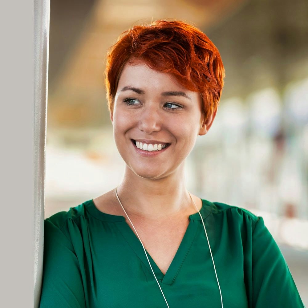 Woman smiling while looking to the left
