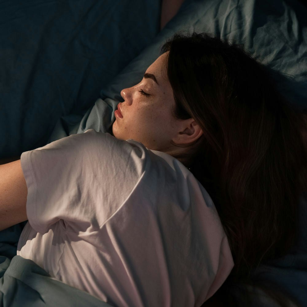 Resting woman in need of sleep apnea treatment