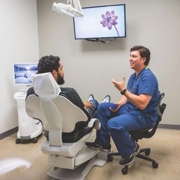 Dr. Ip talking to patient