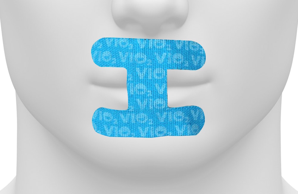 blank 3d model head with vio2 tape over mouth