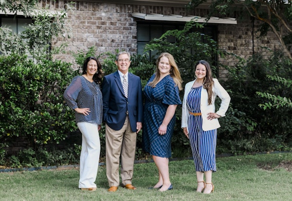 Attorneys Randy Michel and Hayley Harrison and staff