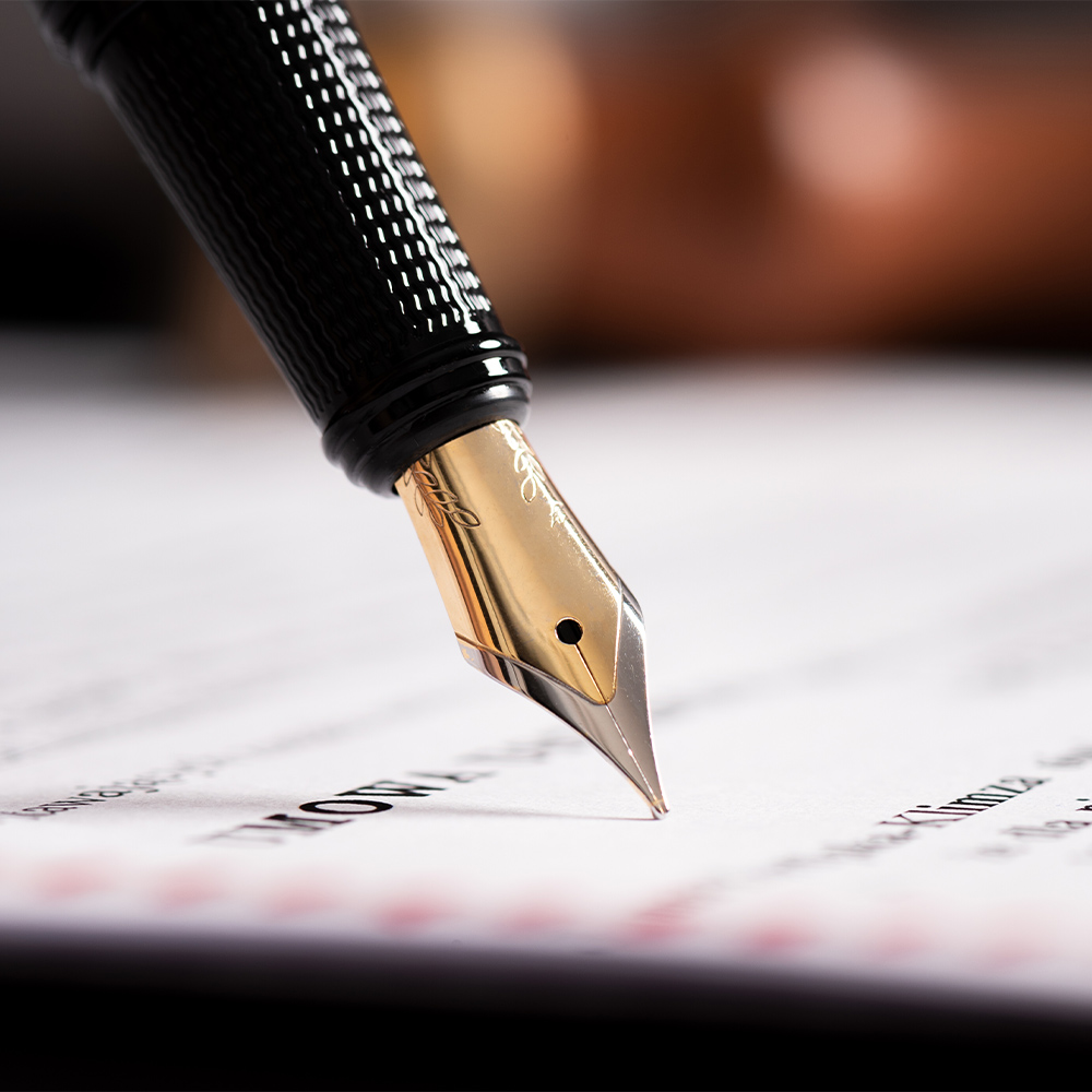 a pen signing a contract