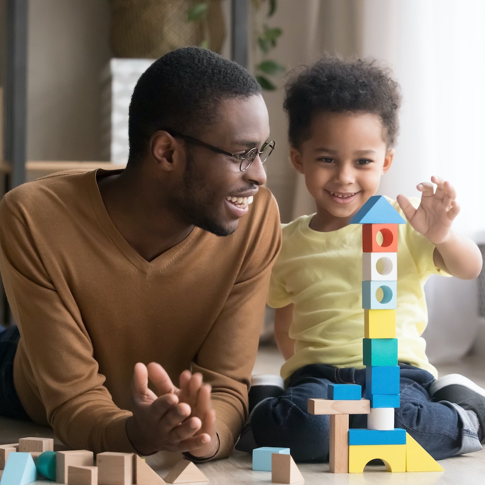 Father and child playing together