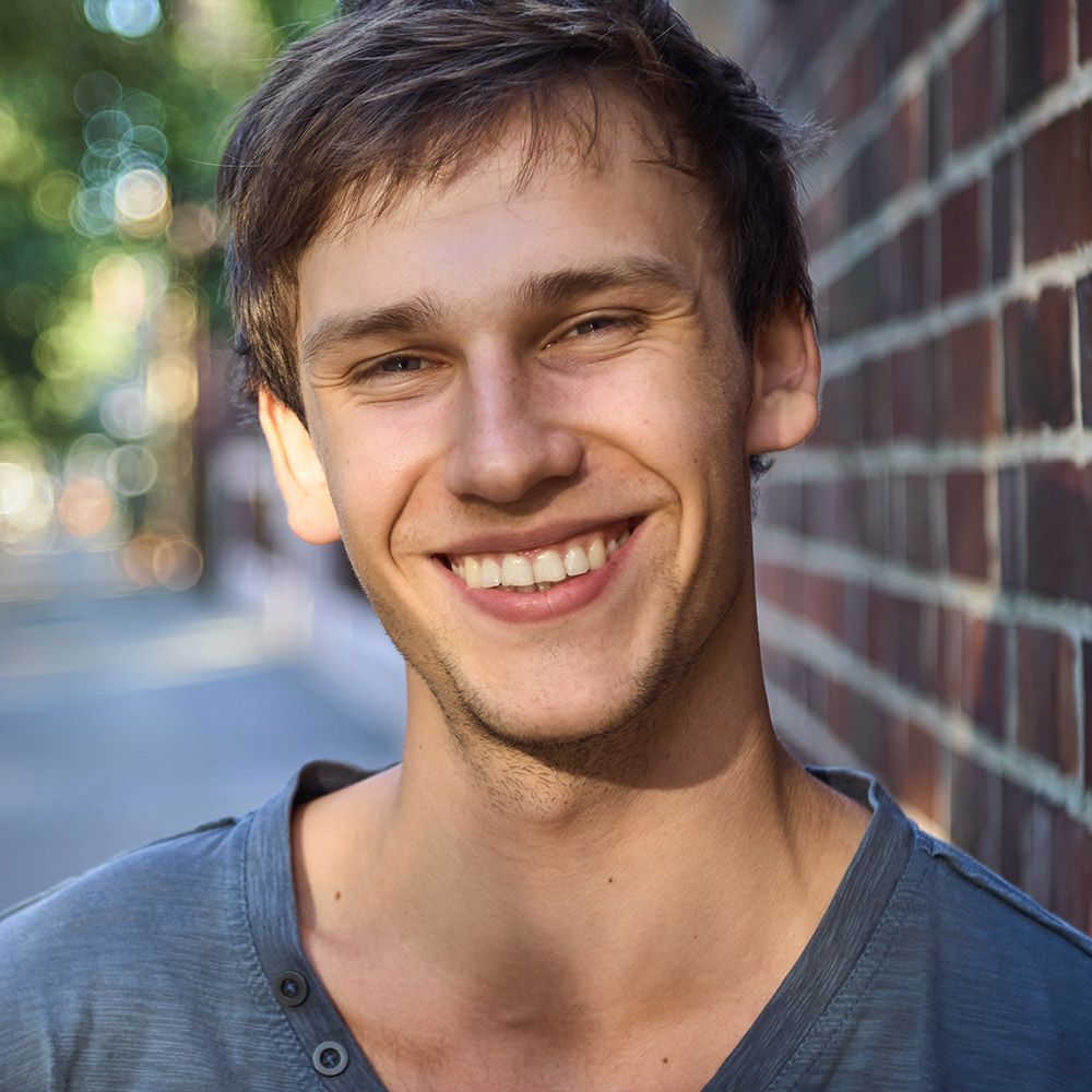 Smiling man wearing blue shirt
