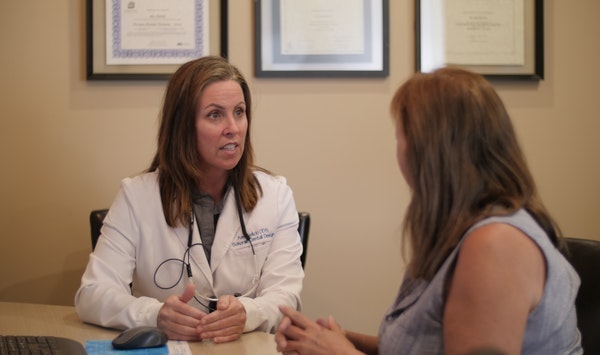 Dr. Ann Sielicki talking with patient