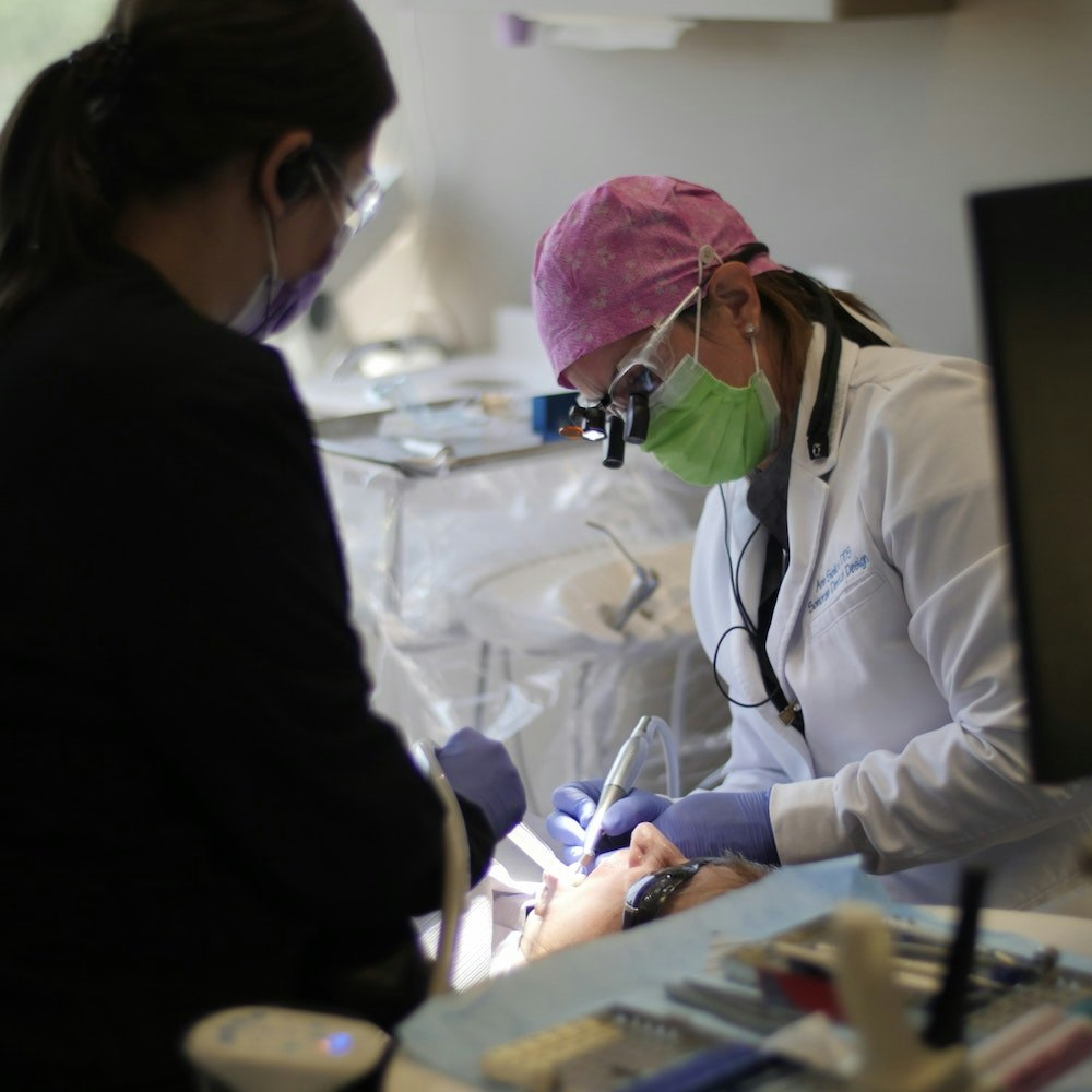 Dr. Sielicki checking patient's teeth