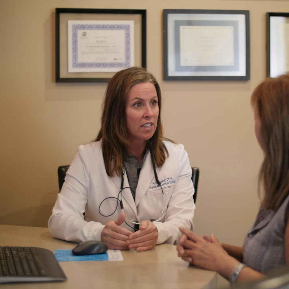 Dr. Sielicki talking to patient about dental plan