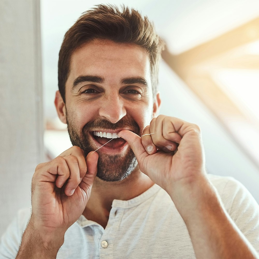 Man flossing