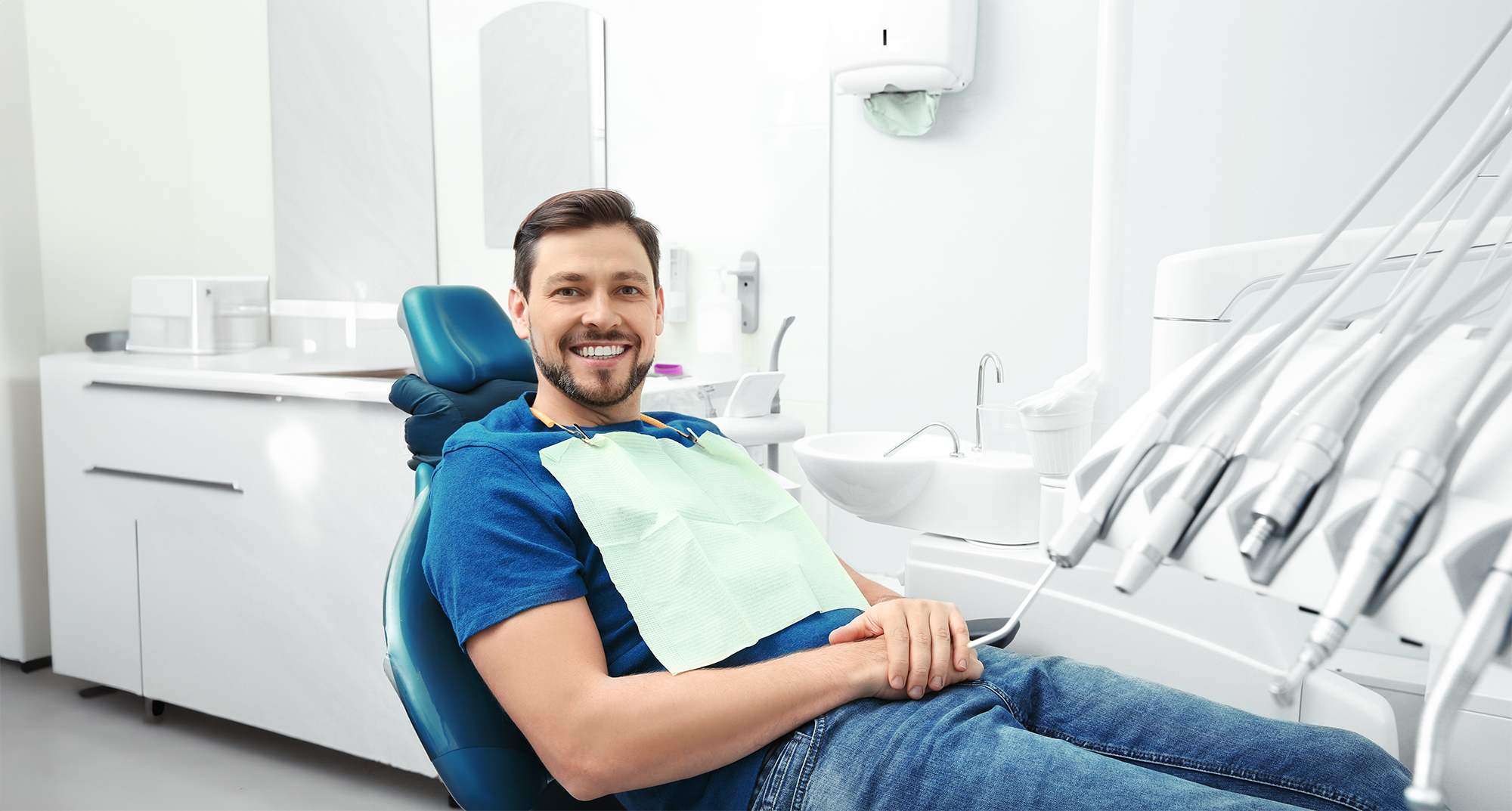 Man smiling at the dentist