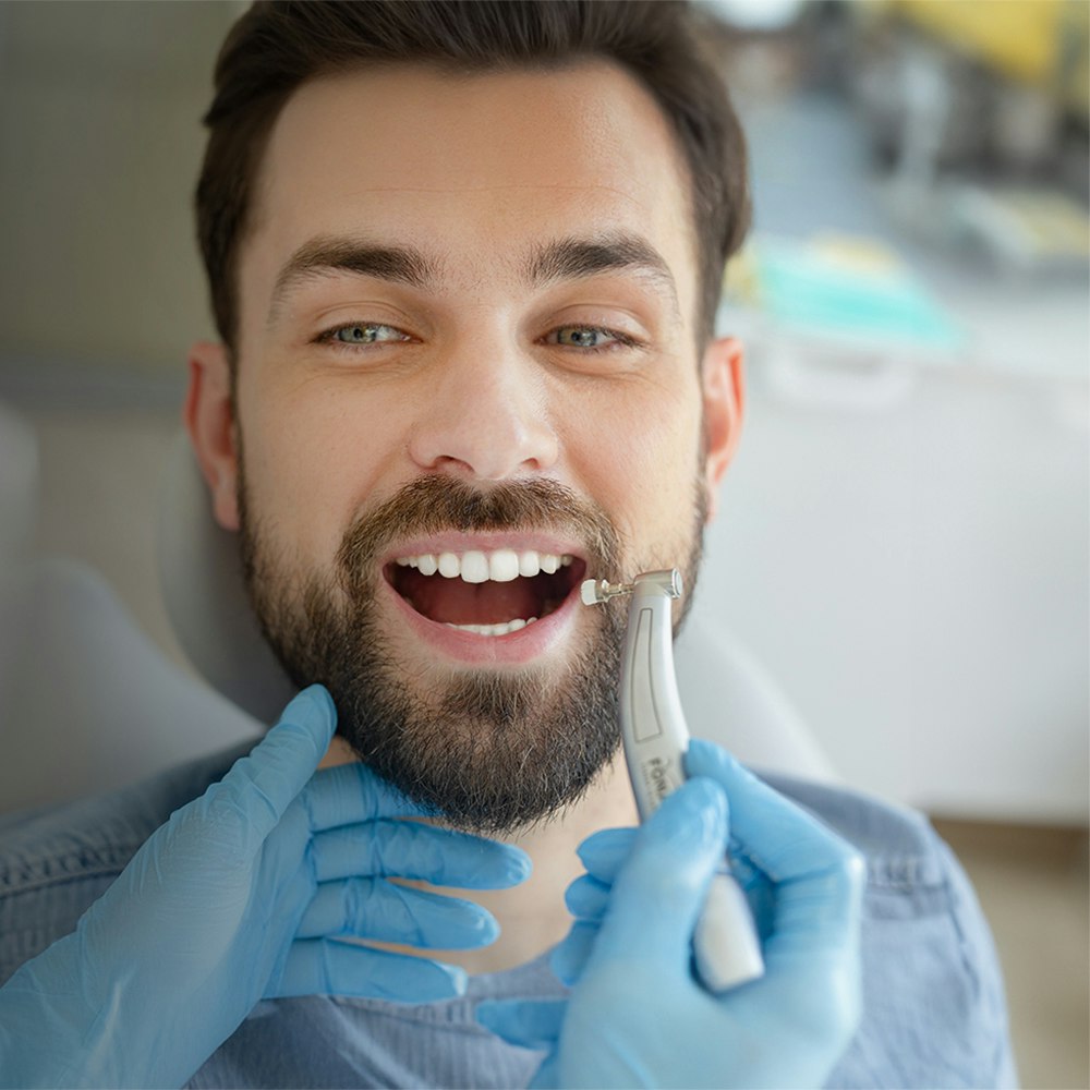 man getting his teeth cleaned