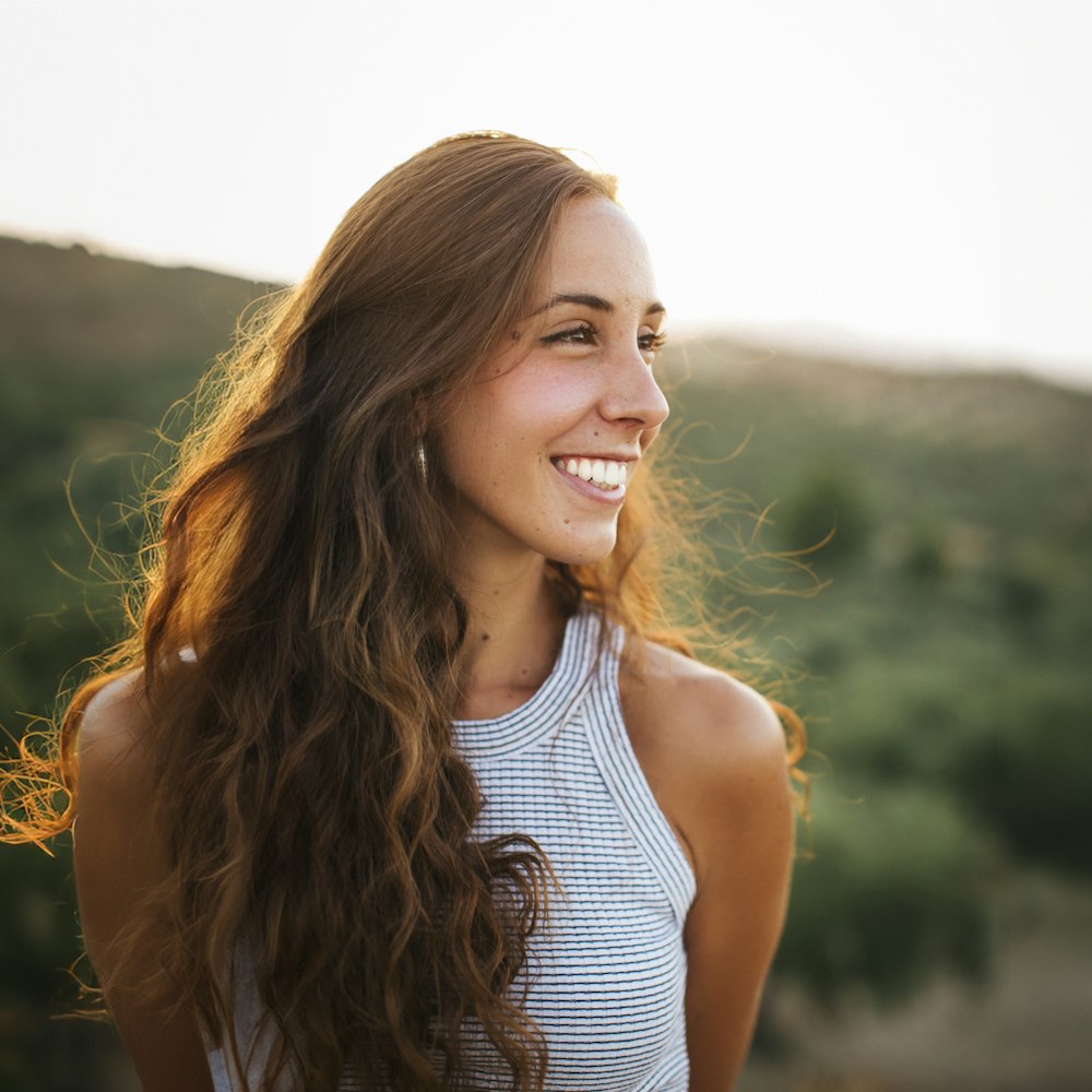 Young woman smiling while hiking