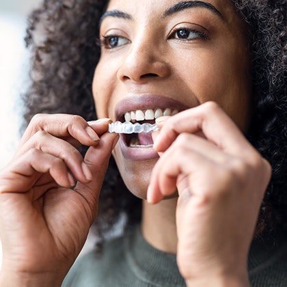 woman using invisalign