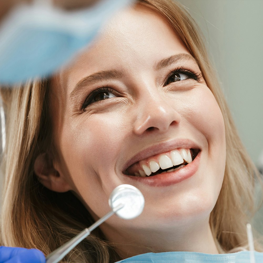 Smiling woman at the dentist