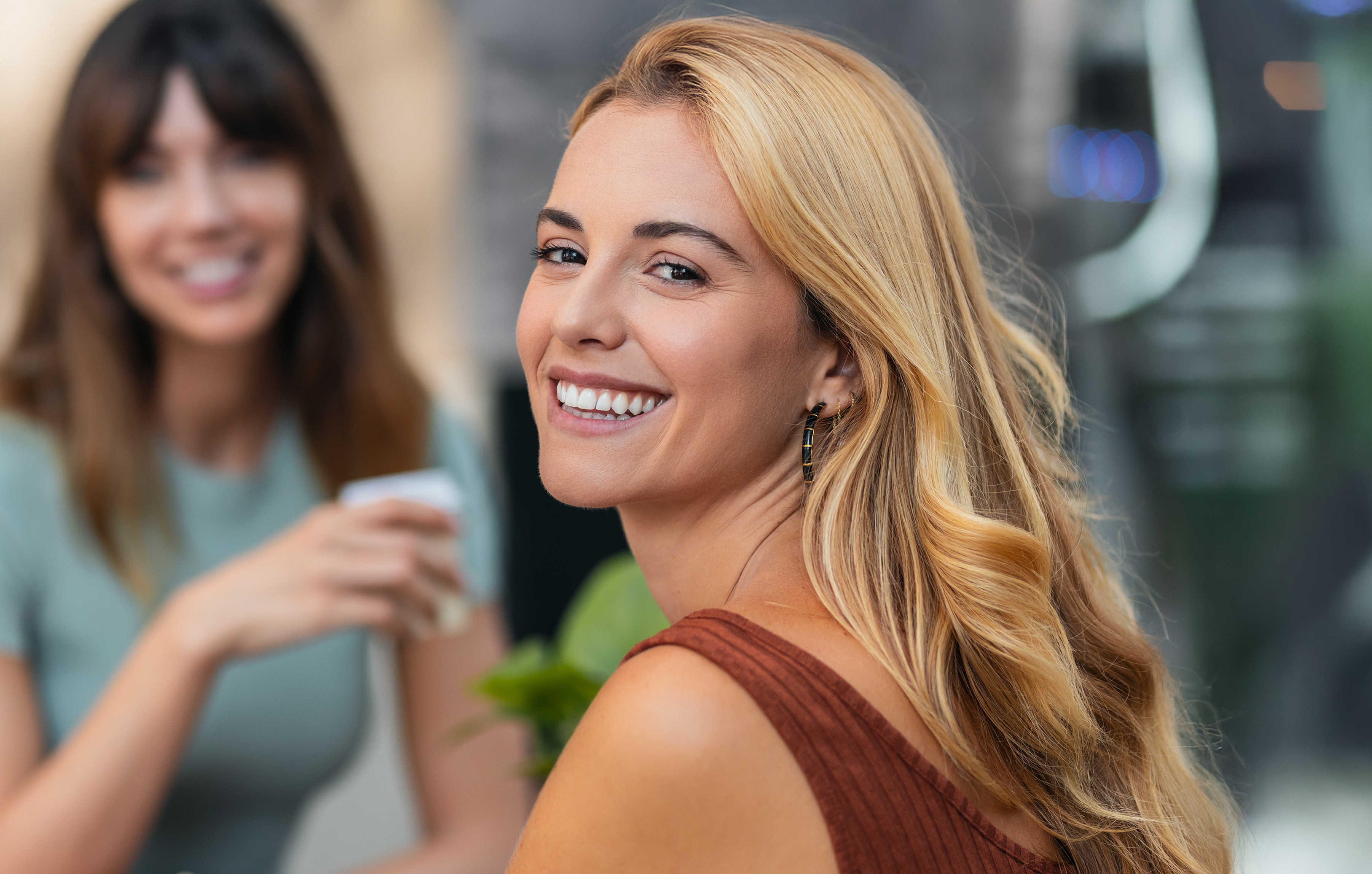 Smiling couple hugging each other with teeth whitening