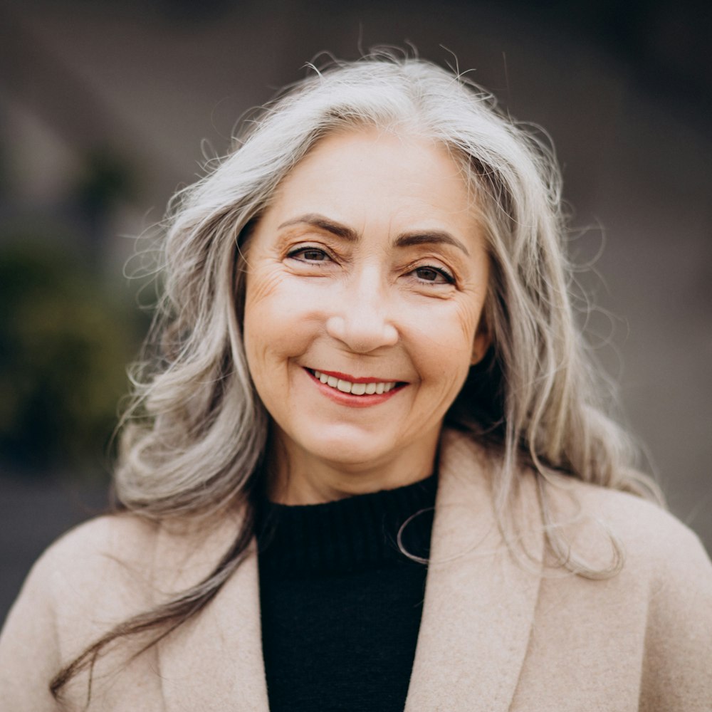 Mature woman smiling outdoors