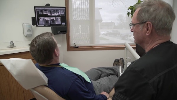 Dr. David Casagrande with a patient in the dentist's chair