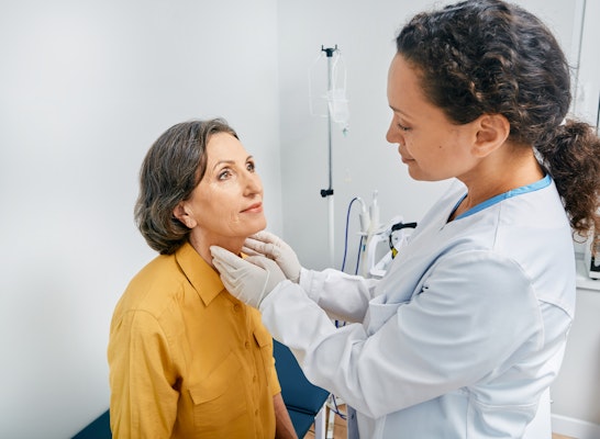 Patient receiving exam from doctor