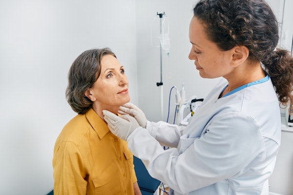 Patient receiving exam from doctor