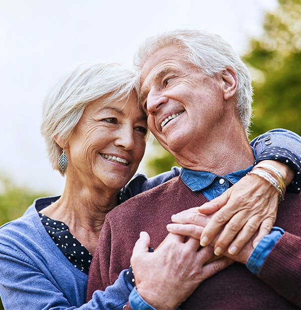 Smiling couple hugging