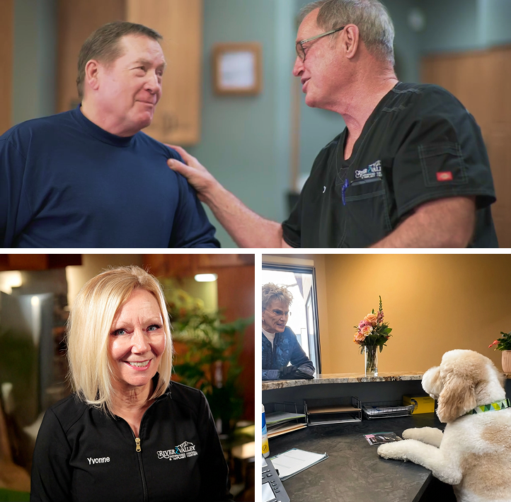 Doctor with a patient, staff, and office dog greeting a patient