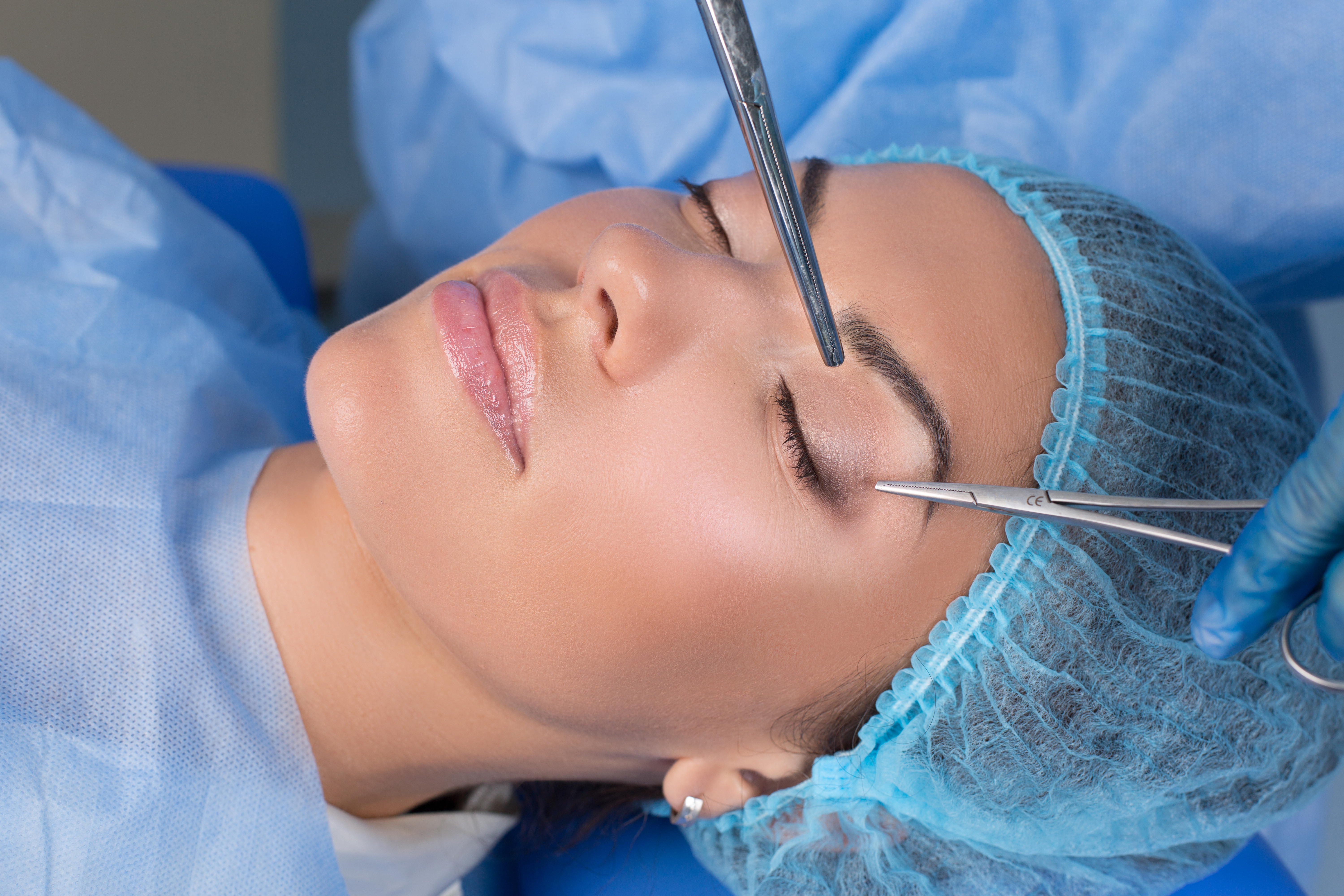 Woman having brow examined