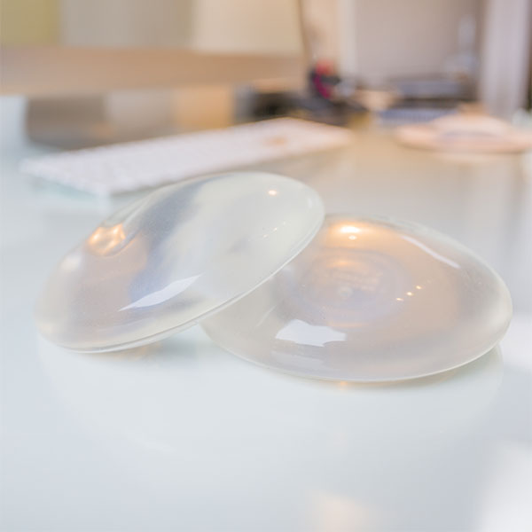 Doctor holding Silicone Breast Implant