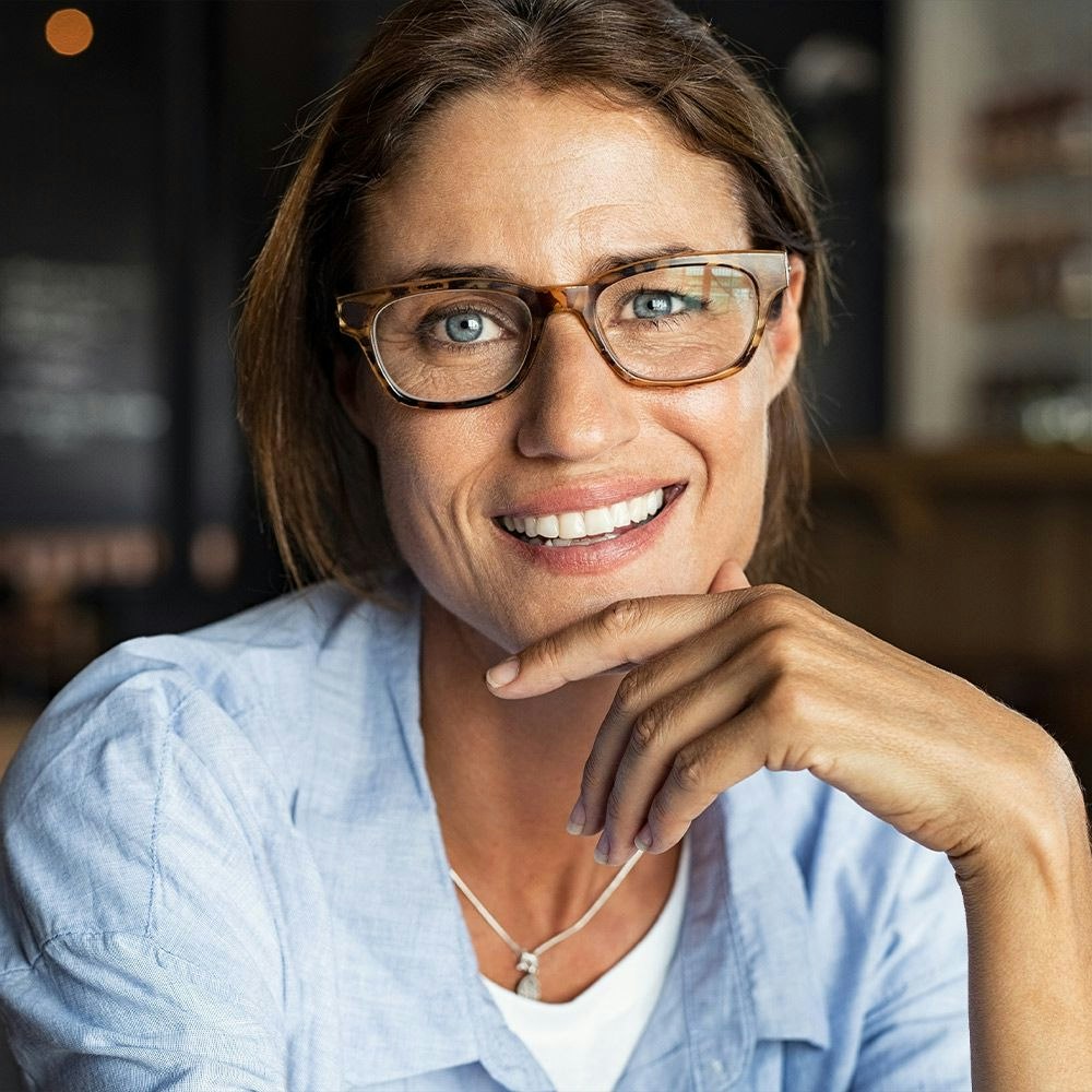 Smiling woman in glasses