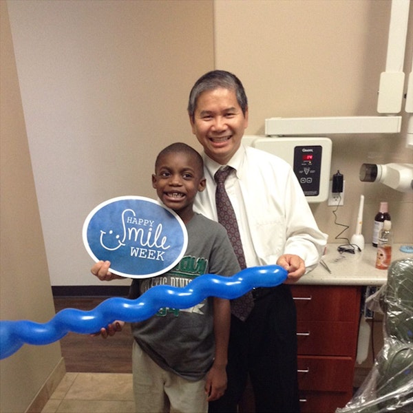 Dr. Phan with a happy young patient.