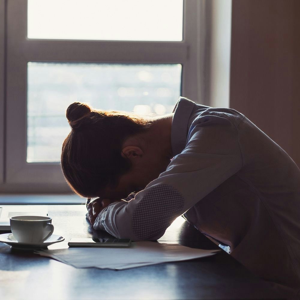 Woman sleeping at desk