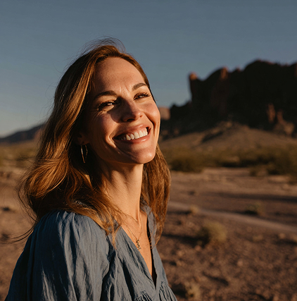 Middle-aged woman with a beautiful smile and AZ desert in the background